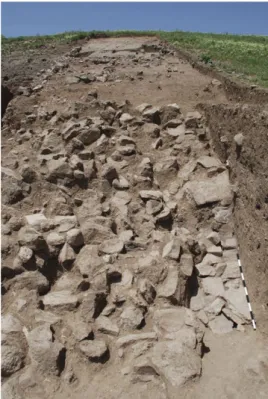 Fig. 45: Some stones of the glacis in place, on the  right, below the fallen stones. From east