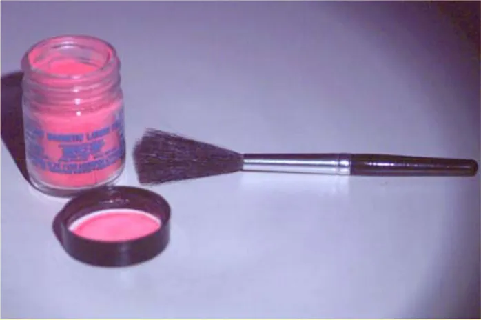 Fig. 14: UV Luminescent powder with a squirrel brush.  