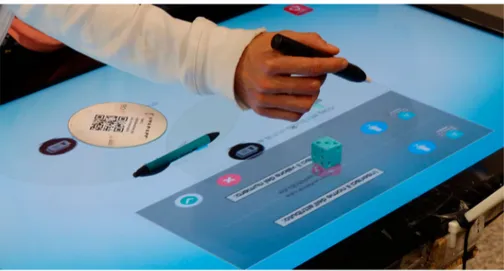 Figure 3. Tactile system: user puts smart objects and tangible attributes on the display and speciﬁes attribute names and values by