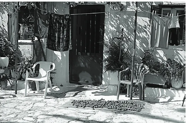 Figure 1. Historic street stone paving as a floor of an “open air” living room. South Italy village
