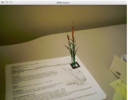 Figura 1.4: Visualizzazione del modello di una pianta tramite il marker posizionato sul libro, da [2]