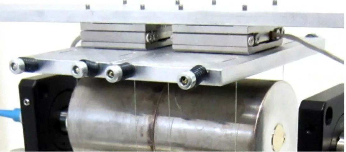 Figura 8 I nanoposizionatori sono posti tra il telaio e le piastre di sospensione. 