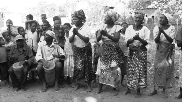 Figure 7a-c. Frames corresponding to the first three claps in the pattern. The  first  two  claps  (Figure  7a  and  7b)  coincide  with  an  after-beat  stroke  of  the  right hand of the mbandambanda drummer (on the left), while the third clap  (Figure 7