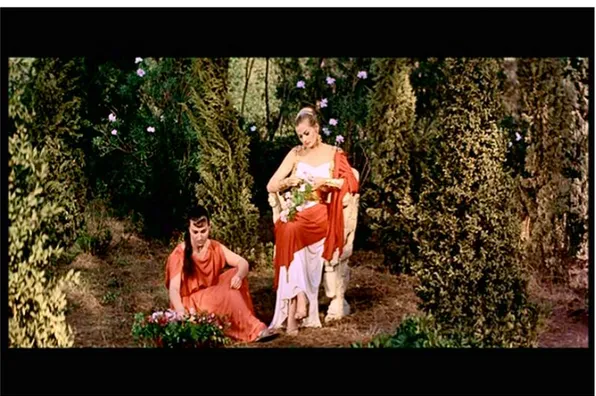 Figura 8. G. Brignone, Nel segno di Roma (1959). Zenobia (Anita Ekberg) intreccia corone di fiori in un giardino