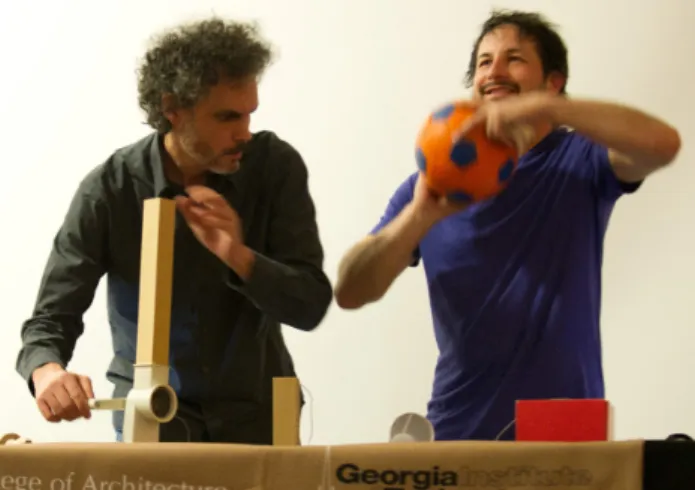 Figure 4 : Frédéric Bevilacqua and Julien Bloit from IRCAM using kitchen utensils and a football to play music (Rasamimanana et al., 2011 )