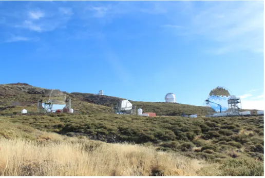 Figure 1.6: Image of the MAGIC Telescopes. The MAGIC 1 and MAGIC 2 telescopes can be seen on the left and in the middle, the LST 1 telescope on the right