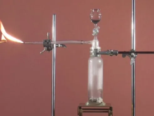 Figure 1. Demonstration experiment “Carbide lamp”: Calcium carbide reacts with  water under formation of the combustible gas ethyne
