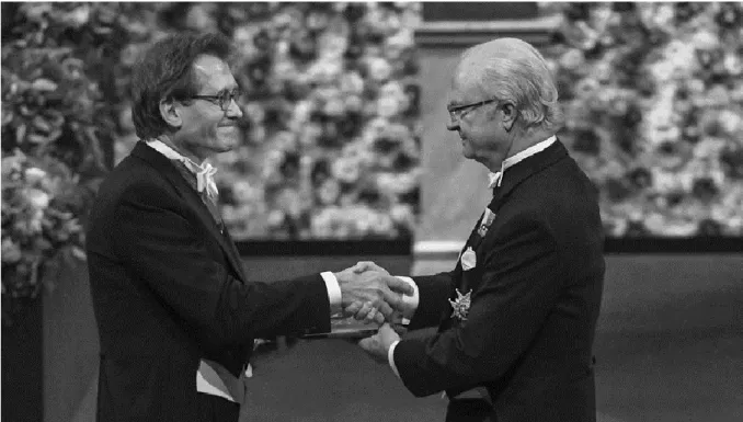 Figuur 4: Ben Feringa ontvangt de Nobelprijs van de Zweedse koning Carl XVI Gustaf 