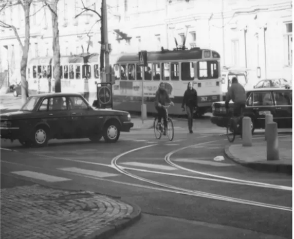 Figure 1. Bicyclists and a pedestrian taking advantage of the courtesy expected of drivers (Photo: Mikael Jonasson).