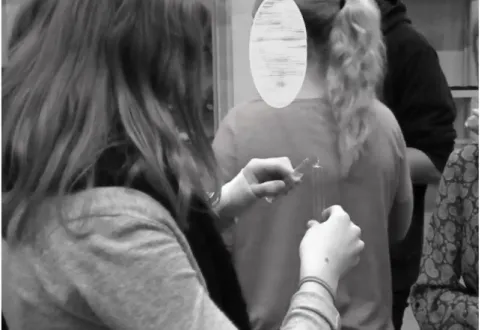 Figure 1. The students exchange “body fluids” using test tubes in the simulation of the spread of  Ebola during lesson 5.