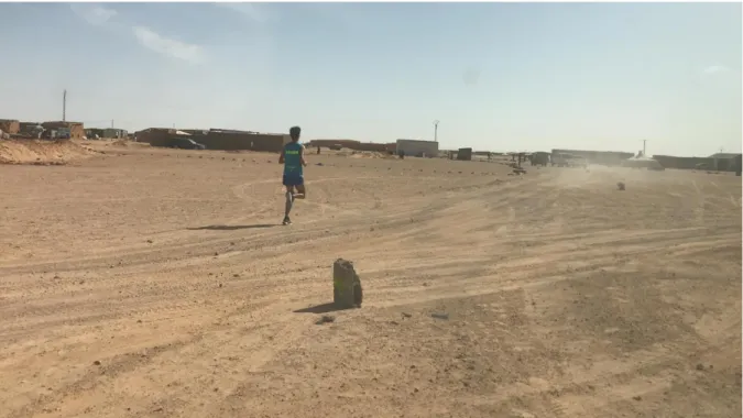 Figure 3. A Saharawi athlete running the Sahara Marathon throughout the desert. Credit: Celia Sánchez-Valladares/2020