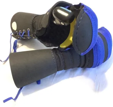 Figur 4. Sparring Glove Mitten. Tumskyddet är en solid del som glider av när tummen rör sig bakåt