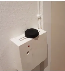 Figure 3 . Buttons placed next to traditional switches  in a participant’s home. 