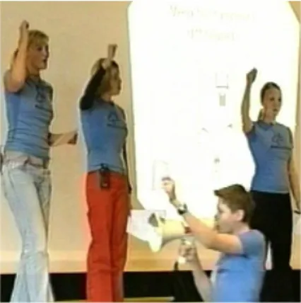 Figure 2. Still from one of the  travelling activist TV episodes, where  high-school students organize a  cer-emony of grading the teachers.