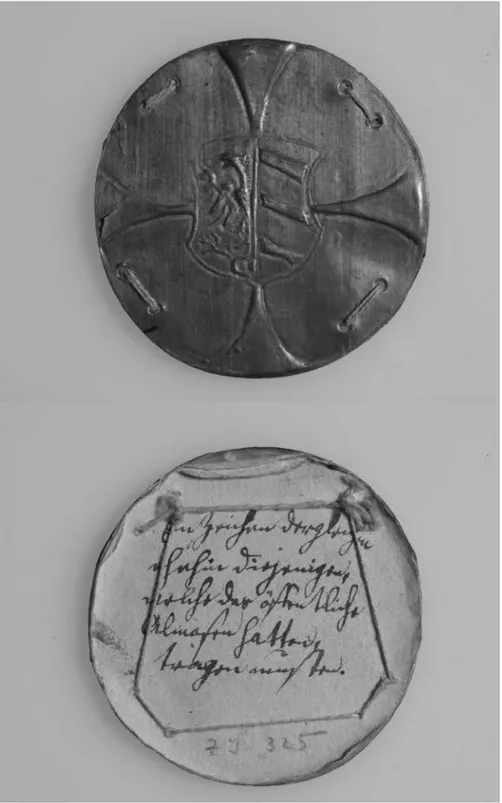 Figure 4.1. Front and back side of a badge for beggars made out  of brass and iron, Nuremberg, Mid-sixteenth century