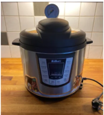 Figure 5: The pressure cooker with a manometer installed on the lid.