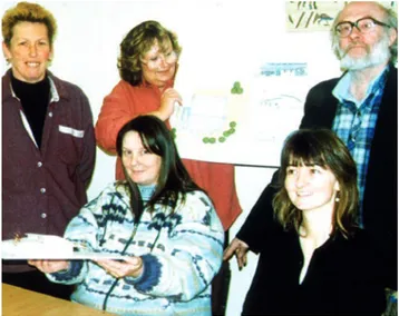 Figure 7: Residents showing initial plans and a sketch model of new community  facilities                     