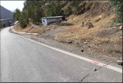 Figure 4: Location of a crack along the area above the landslide area (Crack  is marked by red and white rope) and then extends down across the paved 