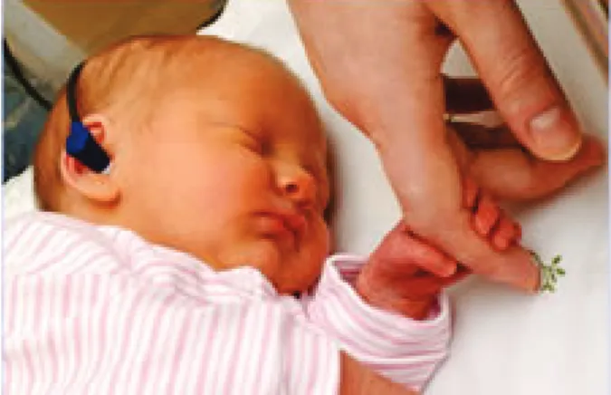 Figure 5: Newborn hearing screening with automated otoacoustic emissions  Permission to use image granted by Public Health Wales, Child and Maternal 