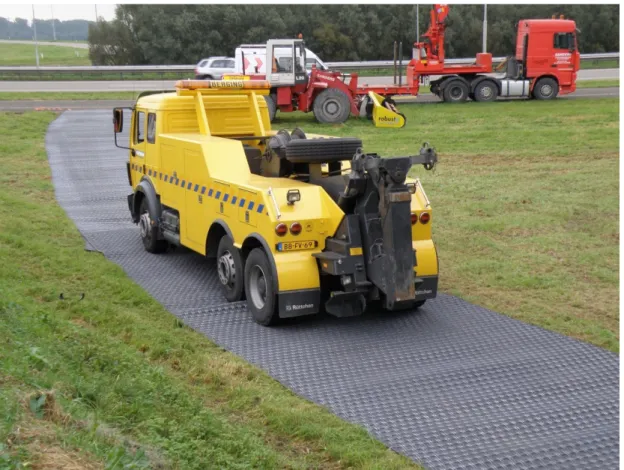 Figure 1. Portable roads used as temporary accesses on grass mate. Photo by RVM Vehicle Mobility