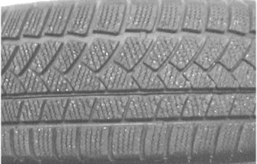 Figure 1  Tyre tread pattern on retreaded tyre without studs but with aggregate mix.
