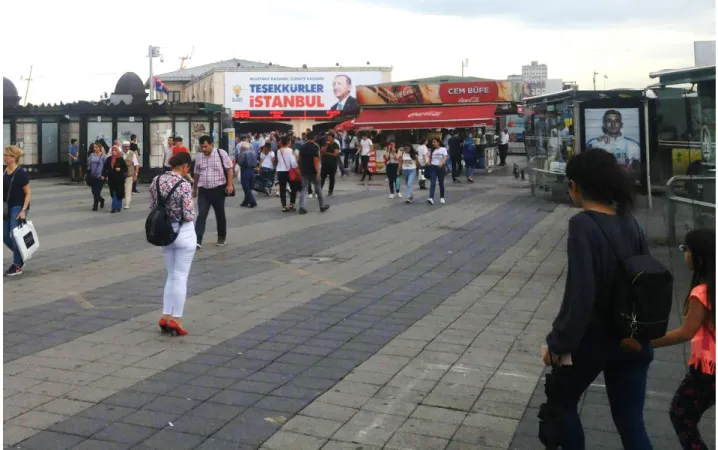 Figure 5: Street scene in front of the very busy ferry terminal in the district Kadıköy featuring a large  post-election poster displaying Turkish president Recep Tayyip Erdoğan and the text “Our nation has  won,  Turkey  has  won