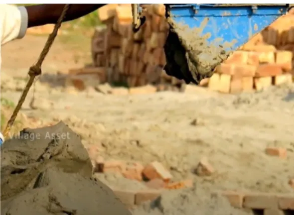 Figure 3: Excavator adding clay and soil mixed with water into the process machine.