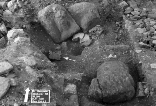 Fig. 3. Rapperswil-Jona, Kempraten, Zürcherstrasse 131, Mithraeum Phase 3: Northernmost area   of the central aisle with two large fragments of a sandstone cult image in the background and a small 