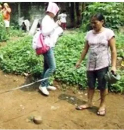 Fig. 3. A member doing the plot staking out of the proposed site 