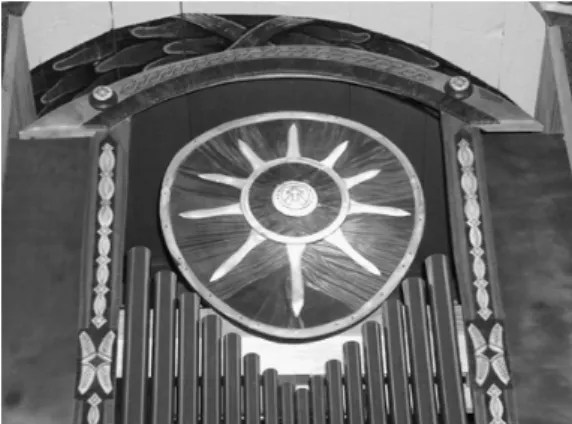 Fig. 2. The organ of the Sami church in  Jukkasjärvi, decorated with the symbol of the  Sun set within a circle recalling the shaman  drum