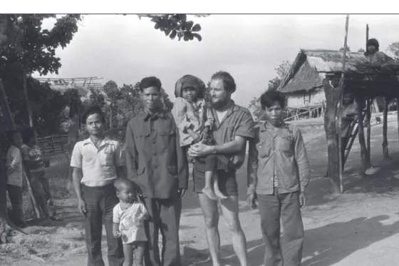 Figure 4. Gábor Vargyas with three men, holding a small child. October 7, 1986, Hoong village, photo  taken by Vu Dinh Loi (?), using Gábor Vargyas’s camera