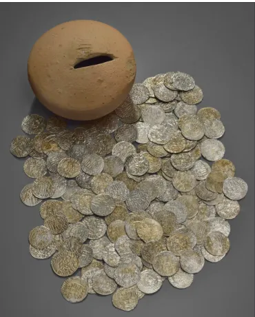Fig. 5. Pottery moneybox from the floor of the late medieval  house’s basement with coins from the reign of Matthias 