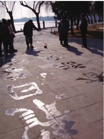 Figure 5: The sacredness of writing. Outdoor calligraphy in Beijing. 