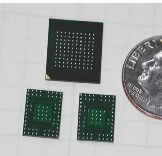 Figure 6. Two ASDBLR and one DTMROC ASIC, in their custom FPGA packages are shown in comparison with a US dime for size comparison