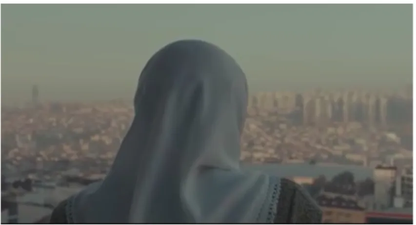 Figure 5.4: Nigar Looking through the Window 