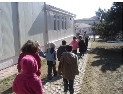 Figure 4.1. A view shows children being removed from their building to the   high school building