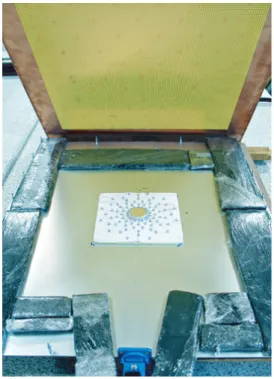 Figure 5. Photograph of the cloak test setup. The upper plate of the parallel-plate waveguide has been opened and is shown to be made of a metallic grid