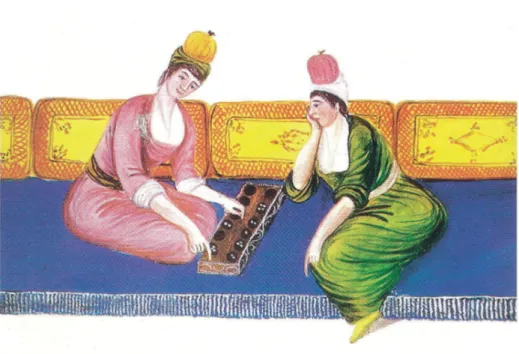 Figure 17. Two women sitting on the sofa and playing Mangala  (Küçükyıldız, 2011).