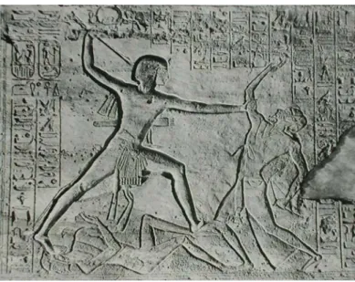 Fig. 5. Sandstone relief of King Ramesses II smiting a Lybian chieftain, in the main temple at  Abu Simbel in Nubia, c