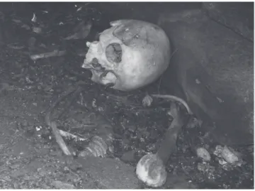 Figure 3. Typical Sámi over ground burial constructed of flat stones on a rocky island in  an inland lake