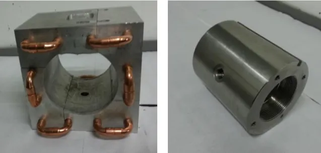 Figure 7. Aluminum cube with copper pipes Figure       Figure 8. Stainless steel cylinder-like container 